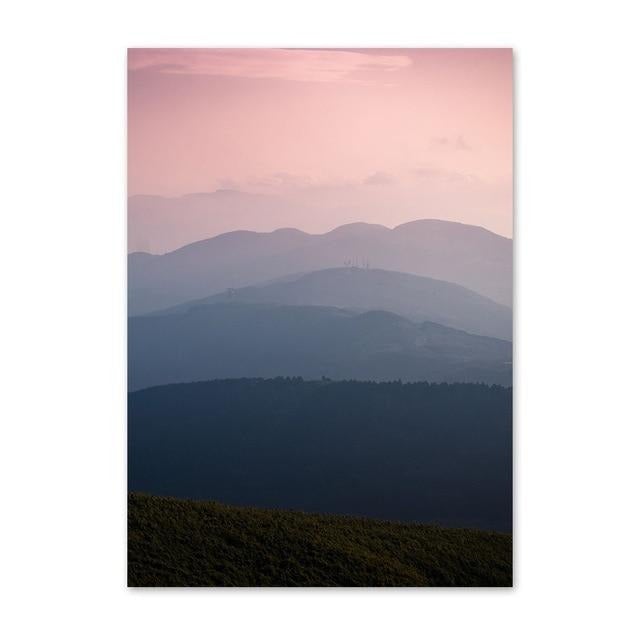 Pink sky with mountains in the distance canvas poster.