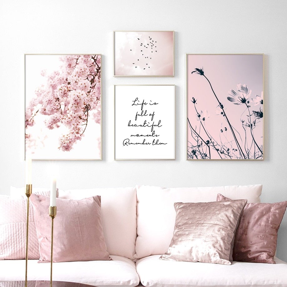 Pink floral wall art set on living room wall above sofa.