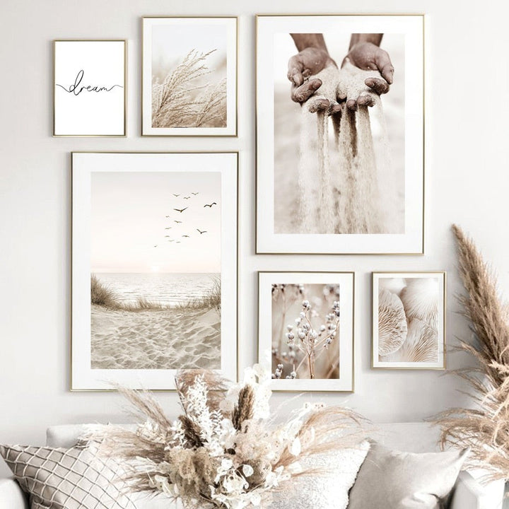 Beige and white wall art set on living room wall.