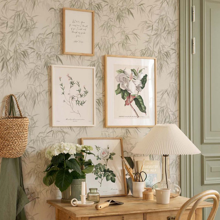 Floral canvas poster set of 3 on wall above desk.