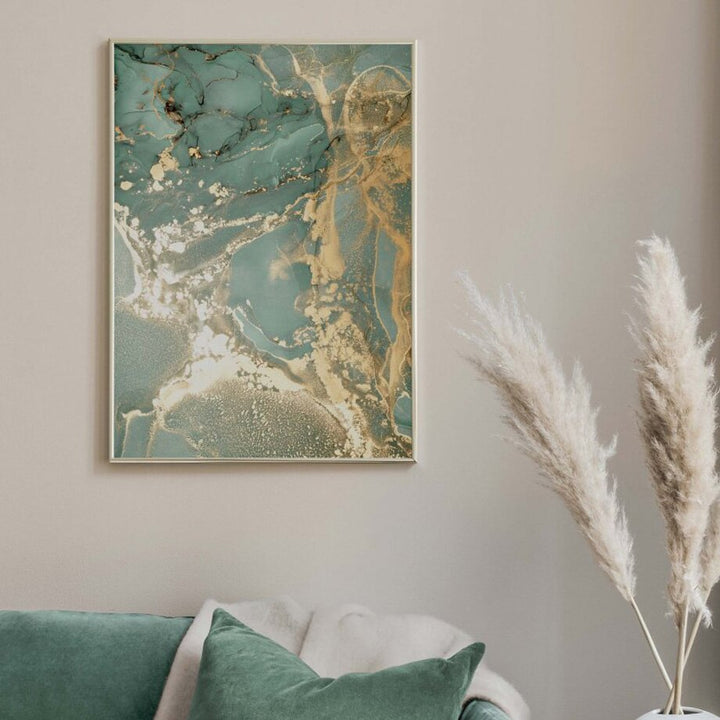 Green and gold wall prints on beige wall.