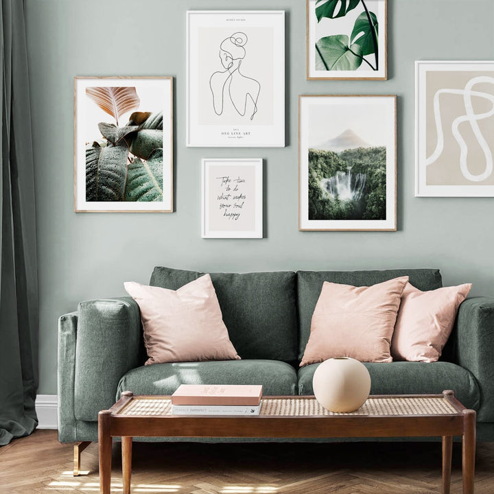 Green nature canvas poster set on living room wall above sofa.