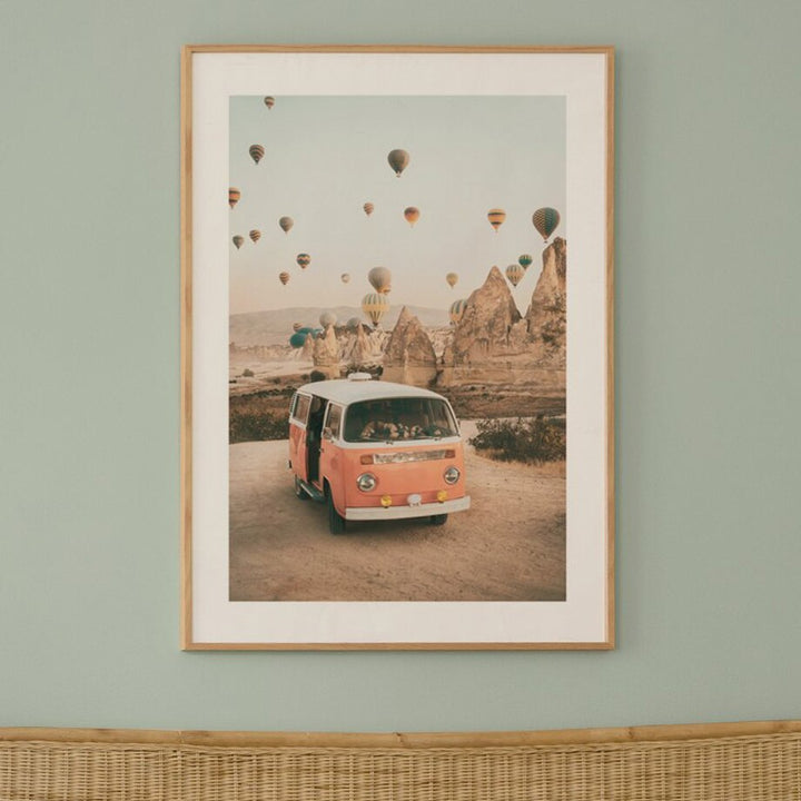 Mini van canyon with air balloons canvas poster with frame on wall.