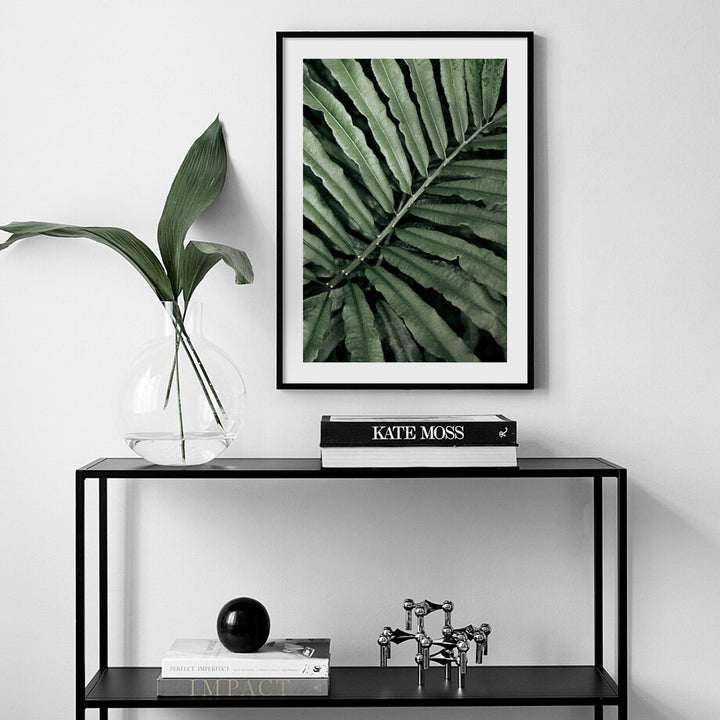 Palm leaves poster on wall.