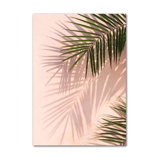 Palm leaves on pink background.