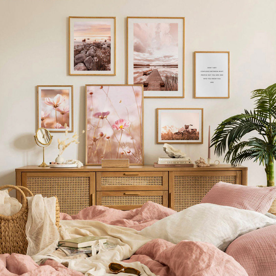 Sunset pink wall art set on bedroom wall above sideboard.
