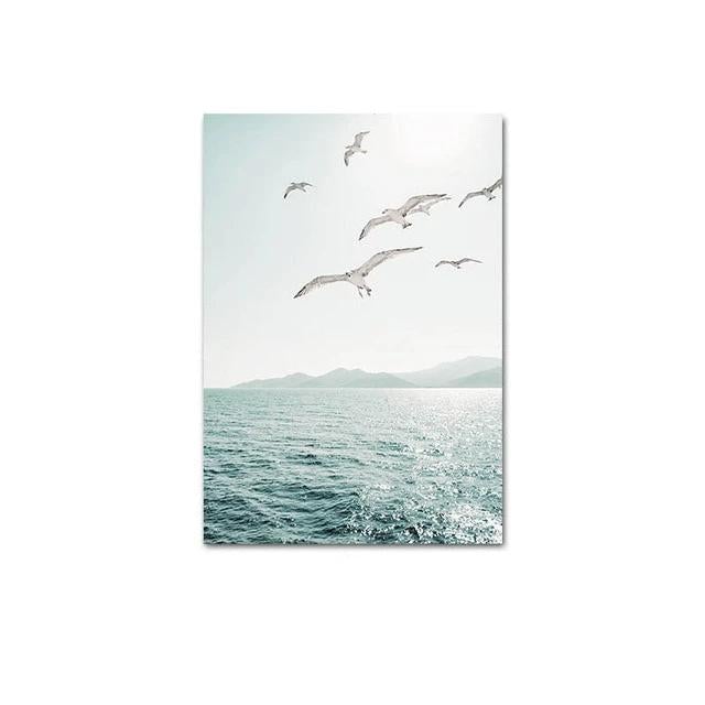 Seagulls flying over the water canvas poster.